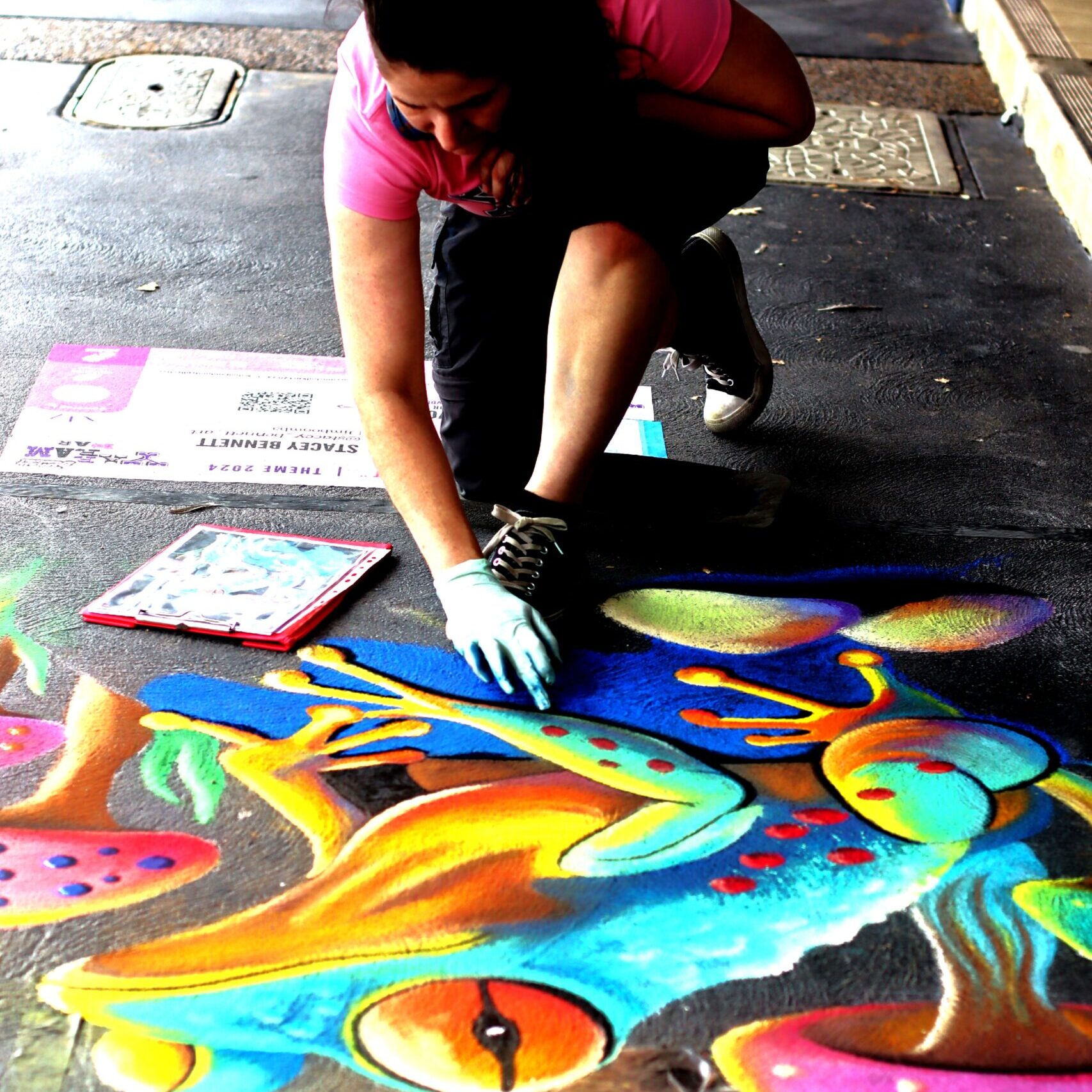 Vibrant frog chalk mural created by Stacey Bennett at the Yarram Chalk Festival